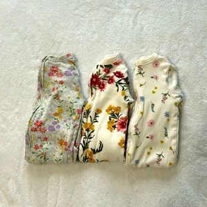 A pack of 3 double zip footed pjs!